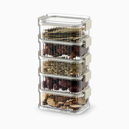 Boîtes de rangement cuisine empilées montrant la configuration multi-niveaux et la visibilité des provisions